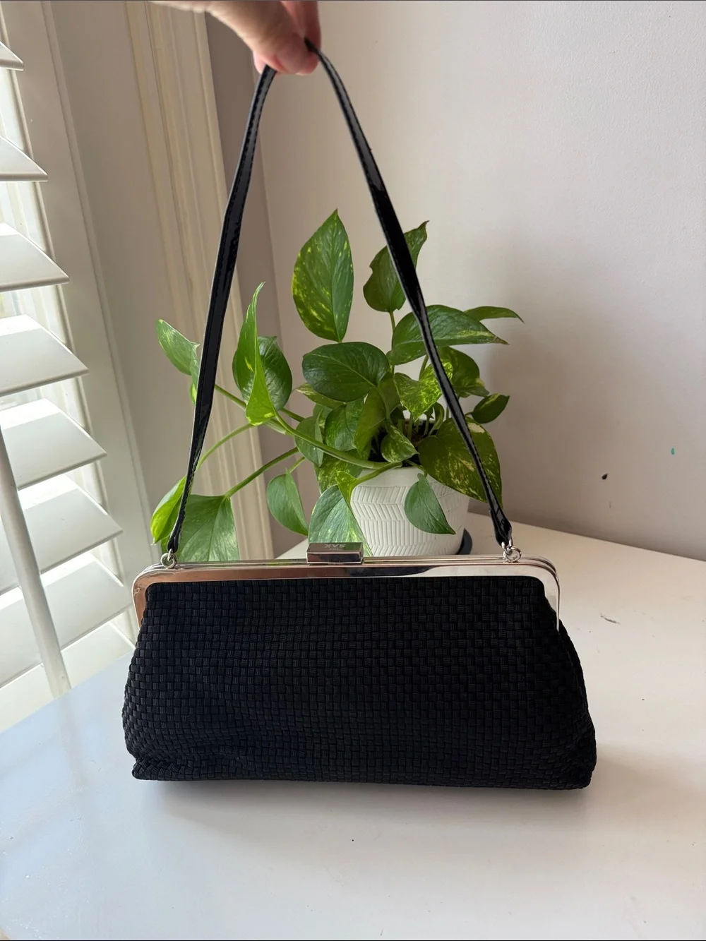The SAK Black Woven Frame Clutch/Handbag with Bow Accent
